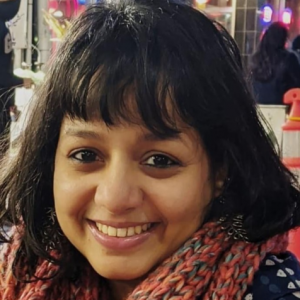 A photo of Swetha Ranganathan staring forward and smiling.